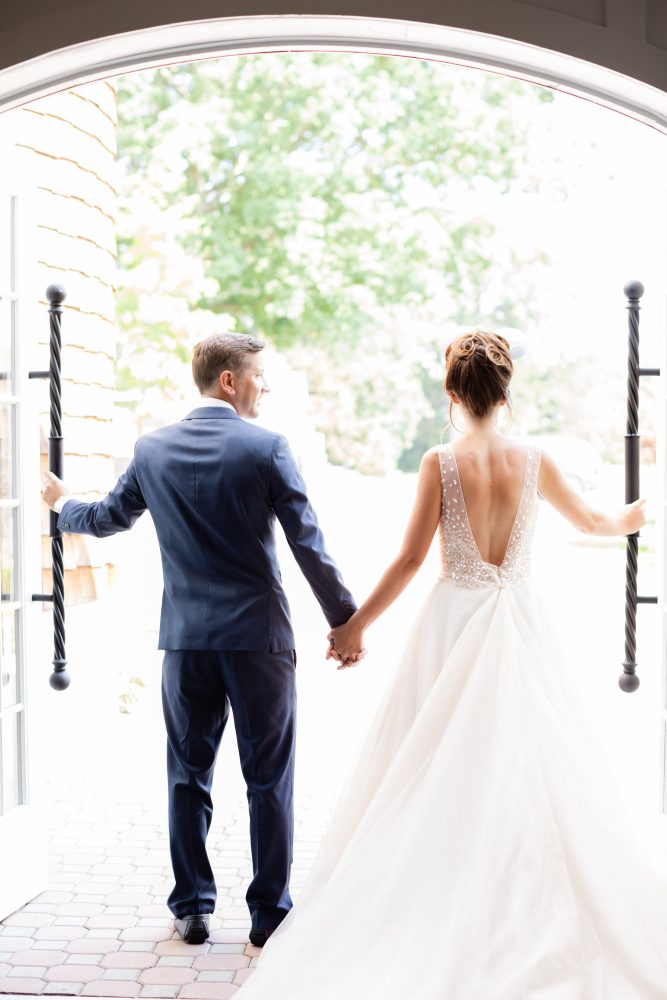 the-ryland-inn-new-jersey-wedding-bride-groom-exit.jpg Bride and groom exiting ceremony at The Ryland Inn in New Jersey with textured bridal updo and open back gown